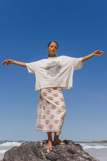 Shanti Tee White — studio back view, white oversized cotton tee showing clean back and boxy fit, paired with spearmint striped pants, white backdrop | Daughters of India