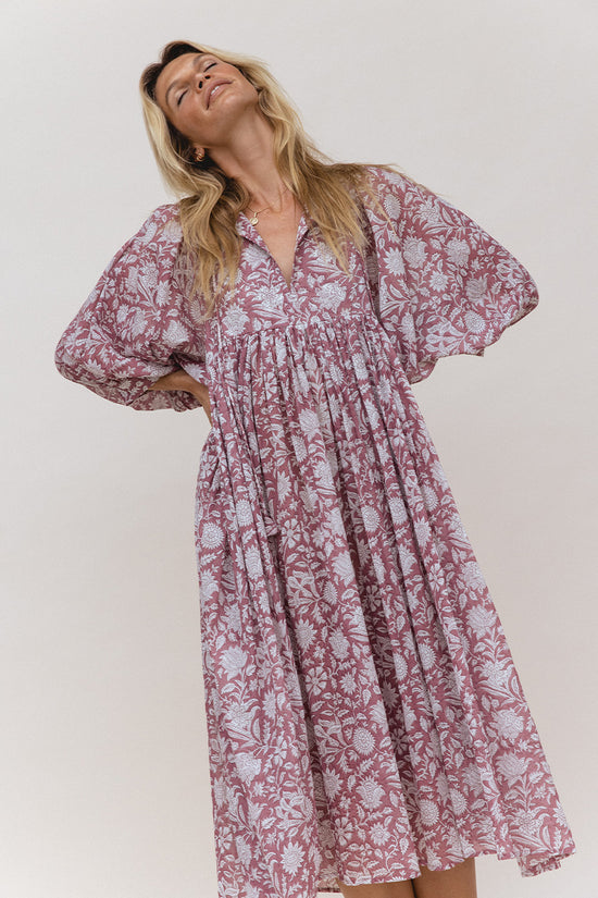 Daughters of India Kyra Midi Dress in Musk — studio V-neckline and billowed sleeves, head tilted back smiling