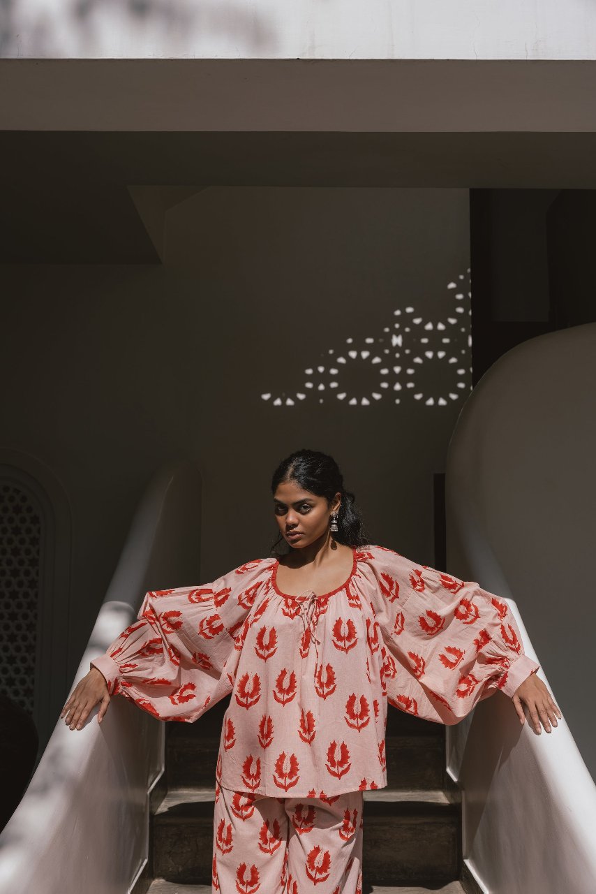 Ria Blouse Cherry Blossom — upper body studio portrait, showcasing blouse neckline, cherry blossom pink hand block print cotton, sustainable Indian fashion | Daughters of India