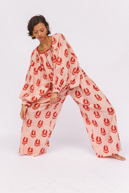 Ria Pants Cherry Blossom — studio full length coordinated set view, model wearing cherry blossom hand block print cotton wide-leg pants with matching blouse, pink floral motif on cream, artisan Jaipur India | Daughters of India