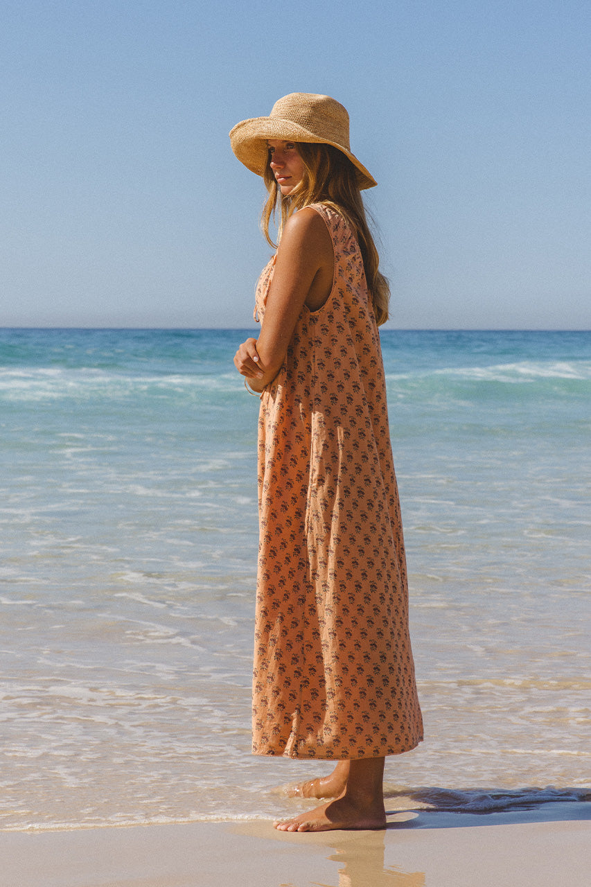 Sundress Midi Peach — studio upper body portrait, model showing tie-gather neckline and shoulder detail, peach cotton block print fabric close-up, handcrafted Jaipur India | Daughters of India